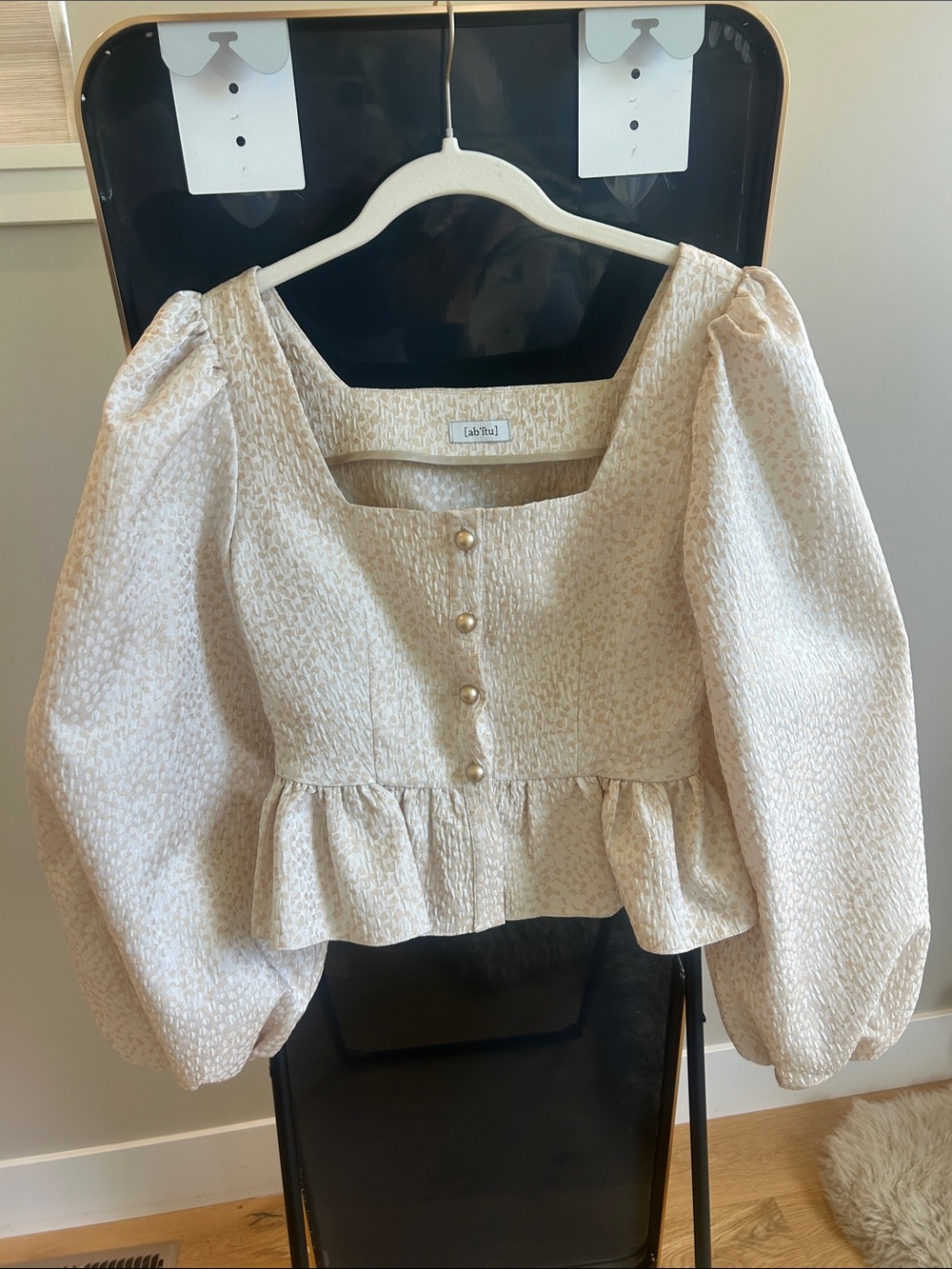 Textured Cream Puff-Sleeve Peplum Blouse with Pearl Buttons